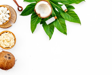 Fototapeta na wymiar Homemade organic cosmetics with coconut on white background top view mock up