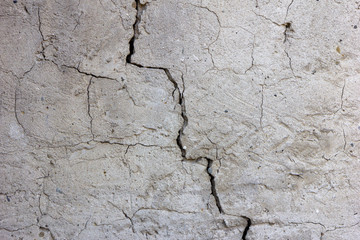 a crack in the plasterwork of a wall 