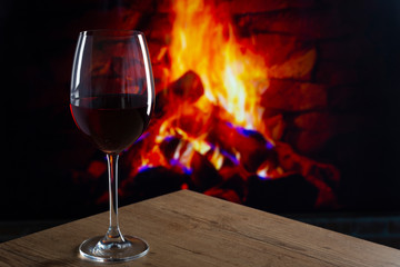 Glass of Wine in front of a fireplace