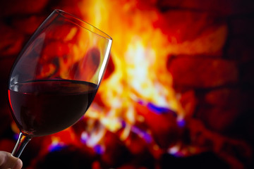Glass of Wine in front of a fireplace