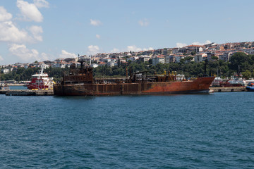 Naklejka na ściany i meble the crane and container load at the port