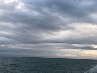 Naklejka na ściany i meble clouds over the sea