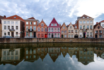 Obraz premium reflection of houses in canal water in Bruges. Belgium