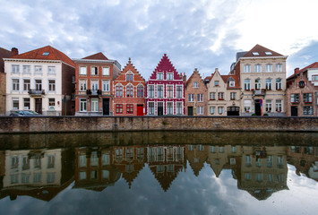 reflection of houses in canal water in Bruges. Belgium