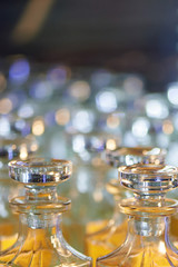 Fototapeta na wymiar Glass perfume bottles based oils. A Bazaar, market. Aroma oils, oil perfume in faceted glass vessels.