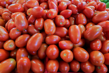 Lots of red tomatoes at the farmers market. Ugly food concept.