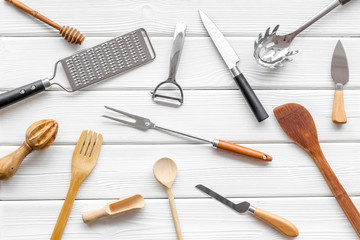 Cookware pattern on white wooden background top view