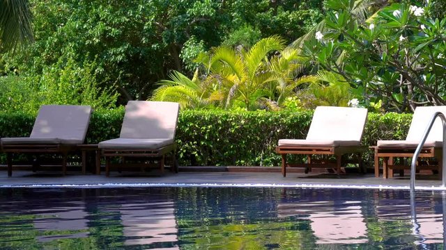 Poolside with sunbeds. Travel destinations. Summer vacations