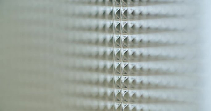 Macro shot of acrylic glass with abstract pattern on it. Movement behind the glass.