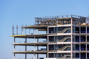 Detail of building under construction with visible steel frame