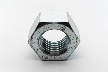 Steel nut, bolt and washers on white background