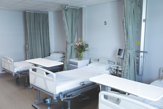 Hospital ward with empty beds