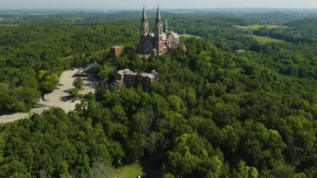 Holy Hill National Shrine of Mary, Wisconsin, USA, aerial forward flight with lift to reveal drone footage.