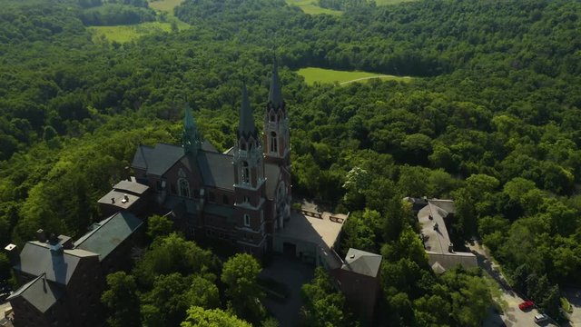 Holy Hill National Shrine of Mary, Wisconsin, USA, aerial birds eye view tracking Basilica drone footage.