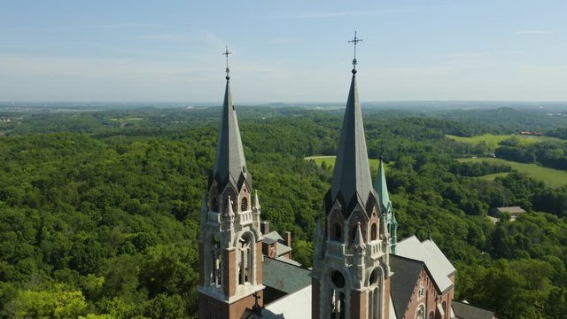 Holy Hill National Shrine of Mary, Wisconsin, USA, aerial pull out to panoramic reveal drone footage.