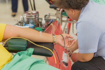 Closeup of blood donor at donation.