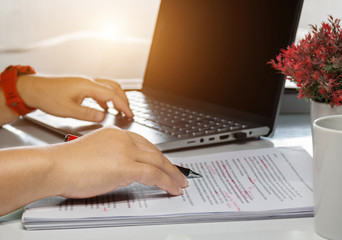 proofreading paper on white table