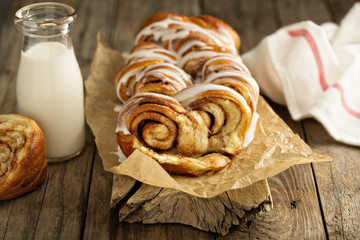 Cinnamon rolls loaf with sweet glaze and milk