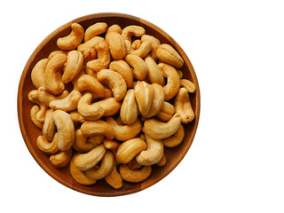 Cashew nuts in a wooden bowl placed on a white background