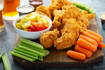 Fried chicken tenders with veggies and sauces