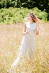 Fototapeta na wymiar young woman in white vintage lace dress