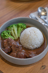 Beef stewed in soy sauce with rice. Cooked beef meat in asian style.