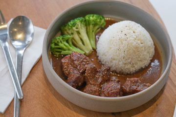 Beef stewed in soy sauce with rice. Cooked beef meat in asian style.