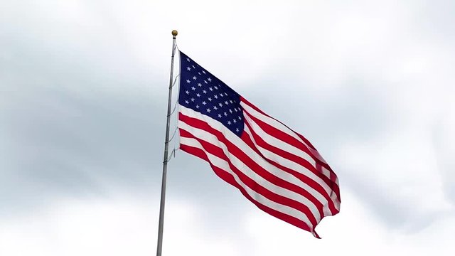 American flag waving in the wind on a beautiful sunny day in slow motion 4H