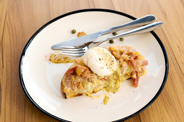 Toast, ham, bacon, cheese and fried eggs for breakfast