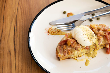 Toast, ham, bacon, cheese and fried eggs for breakfast