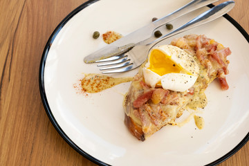 Toast, ham, bacon, cheese and fried eggs for breakfast