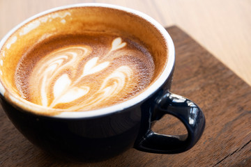 Hot coffee on a wooden table