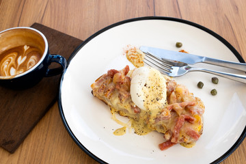 Toast, ham, bacon, cheese and fried eggs for breakfast