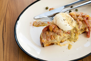 Toast, ham, bacon, cheese and fried eggs for breakfast