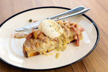 Toast, ham, bacon, cheese and fried eggs for breakfast