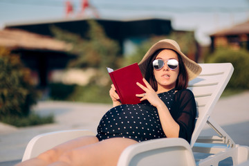 Pregnant Woman Reading a Book by the Pool