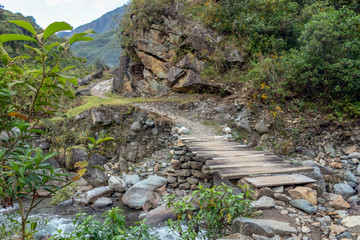Wooden bridge across mountain river