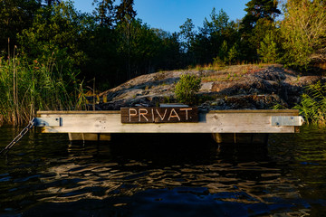 Stockholm, Sweden A small dock on Lake Malaren says "private".