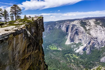 Foto op Canvas A group of people visiting Taft Point, a popular vista point  El Capitan, Yosemite Valley and Merced River visible on the right  Yosemite National Park, California © Sundry Photography