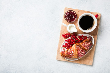 Breakfast with coffee and fresh croissant