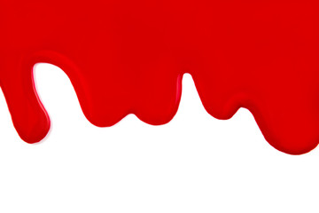 Fluid red nail polish isolated on white.