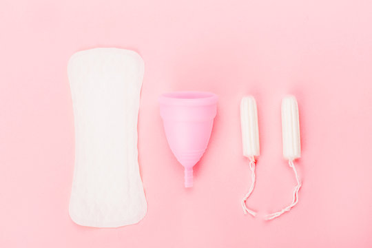 Various sanitary products on pastel pink background. © Yulia Lisitsa