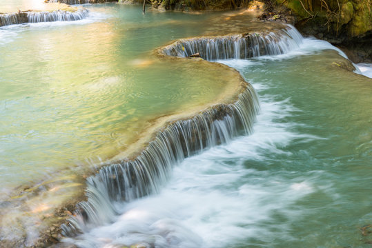 Beautiful landscape of Kuang Si falls an iconic popular waterfalls in the jungle park nearly Luang Prabang town, in north central Laos.
