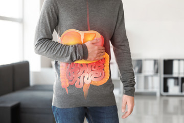 Man suffering from stomachache at home