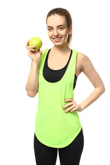 Young woman with apple on white background. Weight loss concept