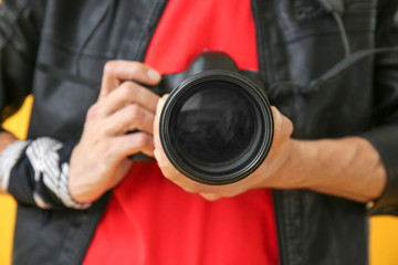 Male photographer with camera, closeup
