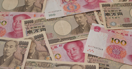 Stack of Chinese banknote and Japanese Yen
