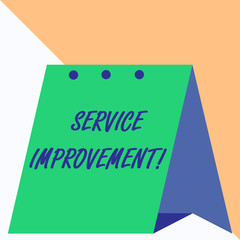 Writing note showing Service Improvement. Business concept for continuous actions that lead to better service or system