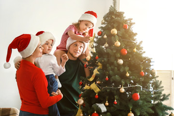 Happy family at home on Christmas eve