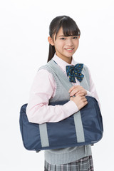学生カバンを持った笑顔の女子校生
